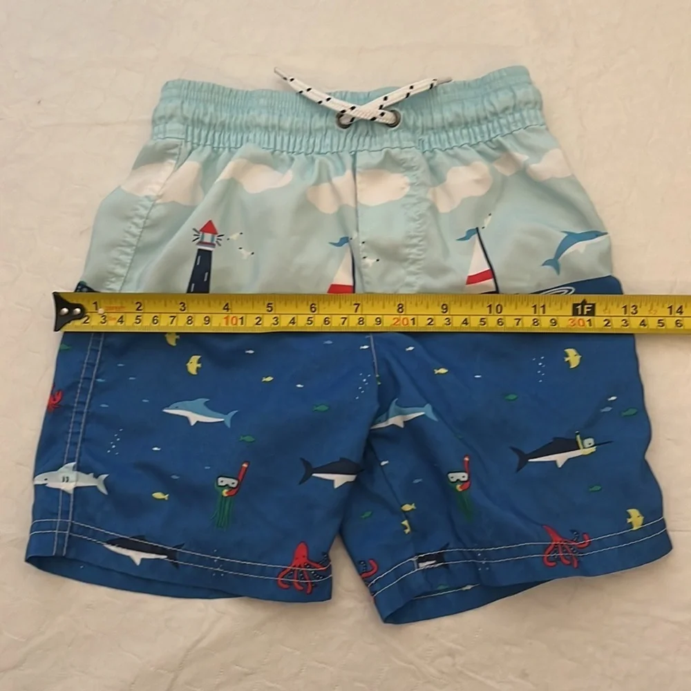 Carter’s sailboat print lined blue multicolor swim trunks